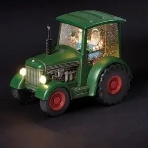 santa driving tractor snow globe