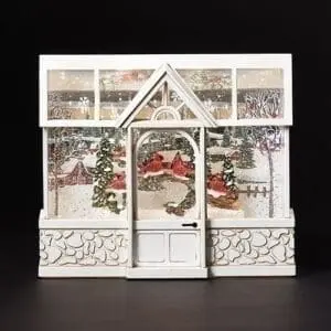 snow globe white greenhouse with cardinals