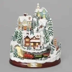 musical lighted mountain village with a rotating train