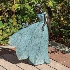 statue angel with bird on dress