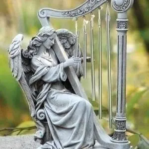 statue angel windchime playing harp