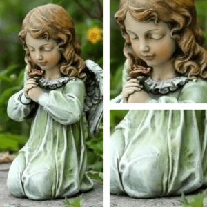 statue angel kneeling with red rose