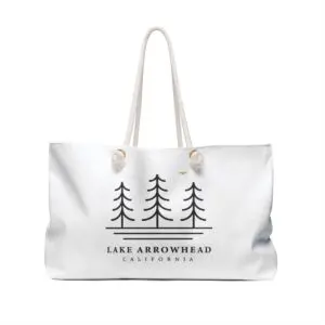 lake arrowhead weekender tote bag with three tree and water line art